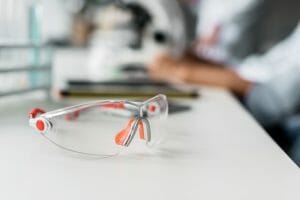 Close-up view of protective goggles on table in chemical laboratory