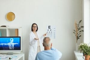 Doctor pointing at eye chart