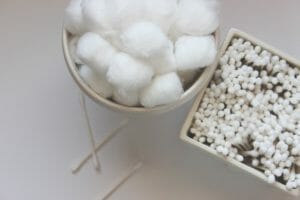 Wash your eyelids and eyelashes with soaked cotton balls