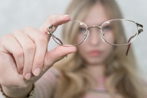 If you find it hard to see far-distance objects such as highway signs, road signs, advertisement board texts, etc. but can easily read books up close, most likely you are suffering from myopia or nearsightedness. American Academy of Ophthalmology also defines myopia as refractive errors in the eyes. Nearsightedness may develop rapidly or gradually, usually worsening during childhood ages and young ages. This condition is pretty common among all of us and quite significantly affects our eye health. Most myopic people are under age 40, and the defect's ratio is continuously increasing at an alarming rate in the past few years. Research showed that roughly 25% of the world's population was nearsighted. The percentage will increase to more than 50% by 2050. Imagine, every second person you know has a poor vision. Myopia Symptoms Myopia symptoms include eye fatigue when you see distant objects or things placed far away, squinting, eye strain, visual stress, and headaches. Myopia may make you feel everything blurry around you. If you feel fatigued when playing sports or driving cars, you are probably suffering from this defect. Distant objects are blurred for myopic people. If you observe these signs and symptoms while wearing glasses or contacts, you should get an appointment with your eye doctor for an eye exam to see if you need a much more strong prescription. Myopia Diagnosis A basic eye exam is conducted to diagnose myopia. The exam includes a refraction assessment and a proper eye health exam. You may come to know that you need to wear glasses to improve your vision. A refraction assessment can easily determine if a person has any vision defects, including presbyopia, nearsightedness, astigmatism, or farsightedness. The doctor will use numerous instruments and tell you to see through different contacts to examine your close-up and distance vision. You may visit Mayo clinic to get yourself diagnosed. At mayo clinic, professional eye doctors can help you with the diagnosis and treatment of myopia. They may give you medical advice to wear glasses. These glasses help you to improve your vision. Your eye doctor will most probably put drops in the eyes to dilate the pupils for your eye health exam. It may make the eyes much more light-sensitive for some time after the exam is completed. Dilation lets your doctor see wider views inside of the eyes. Myopia Causes Myopia occurs due to the structure of your eye. The cornea is the protective outer layer of the eyes. When your cornea is too curved, or the eyeball is too long, the light rays that enter your eyes are not forced perfectly. Instead of focusing directly on the retina (the light-sensitive part of our eyes), the image is focused in front of the retina. So basically, the eyes focus light rays in front of the retina instead of onto it. Due to this wrong image formation, blurred vision occurs. Eye doctor call this a refractive error. Refractive errors are created because the light is not focused directly on the retina. And these refractive errors cause myopia. Myopia normally starts at the early ages of your life. If your parents are myopic, you have a higher risk of developing myopia nearsightedness. In many cases, myopia stabilizes in the early ages of adulthood, but on some occasions, it keeps on progressing with age. Types of Nearsightedness (Myopia) High Myopia This form of the condition is much more serious, in which your eyeball grows more than normal and becomes quite long front to back. Other than making it challenging to see distant objects, it may also increase the chances of developing other eye conditions or eye diseases such as glaucoma, retinal detachment, or cataract. Cataract treatment includes cataract surgery. High myopia is a serious visual defect and should be treated as soon as possible. Degenerative Myopia Degenerative myopia is also known as malignant or pathological myopia. It is a very rare kind sufferers normally inherit from their parents. Their eyeball gets much longer in no time and causes extreme myopia, typically by the teenage or early adulthood. This kind of myopia can get even worse far into adult years. Other than making it tricky for them to view far distant objects, they can also have a greater chance of having glaucoma, detached retina, and abnormal blood vessel growth in their eyes. Visit your Eye Doctor If you are finding it challenging to hold your books, smartphone far away to better view social media posts or seeing objects at a closed distance, you should schedule an eye exam with your eye doctor. Myopia is treatable and, in most cases, slowed in kids. Nearsightedness (Myopia) Treatment There are some good and effective myopia treatments for kids who have myopia. These methods include Ortho-k contact lenses, atropine eye drops, myopia control contact lenses, and myopia control glasses. Nearsightedness may develop quickly or slowly, normally worsening during early childhood ages and adult ages. For grownups, myopia is corrected with standard prescription refractive surgery, eyeglasses, and corrective lenses. On the basis of your nearsightedness, you may require to wear contact lenses or glasses 24/7 or only at times when you require clear, crisp distance vision such as watching movies, driving a car, or viewing a chalkboard. For correcting nearsightedness, you can choose eyeglass contact lenses such as contacts with anti-reflective coating and high-index contacts (for lighter, thinner glasses). Plus, go for photochromic contacts to save your eyes from UV rays and high-energy blue light, which are harmful to your eye health. These contacts reduce the requirement for a separate pair of prescription sunglasses. If you're myopic, the first number ("sphere") on your eye lens prescription or eyeglasses prescription will be preceded by a minus sign (-). The more the number, the more nearsightedness is. The requirement of a contact lens or glasses is eliminated completely or at least reduced with refractive surgery. Mostly, an excimer laser is used to perform most of the procedures. PRK Laser In PRK laser, the laser eliminates the corneal tissue layer, which flattens your cornea and enables light to focus more precisely and accurately on your retina. LASIK It is the most common refractive procedure. In this surgery, a thin flap is made on the cornea surface, a laser eliminates some of the corneal tissues, and then the flap comes back to its original position. There is also a non-surgical treatment in which you wear special rigid gas permeable eye lenses at night that helps to reshape the cornea while you are sleeping. This procedure is known as orthokeratology. When you remove your contacts after waking up, your cornea is temporarily able to maintain the new shape, which enables you to see clearly during the whole day without wearing glasses or eye lenses. Corneal refractive therapy (CRT) is the combination of Orthokeratology and a related GP eye lens procedure. It is effective at correcting mild to moderate amounts of nearsightedness for a short time. If you are not good candidates or too young for LASIK for refractive surgery, you can opt for both of these procedures as fine alternatives to surgery. Another surgical option for correcting myopia is the phatik IOLs, which are implantable lenses. This option is most suitable for people with thinner than normal corneas or high amounts of nearsightedness that can raise the risk of complications from laser vision correction procedures such as LASIK. Phatic IOLs are just like contact lenses and work exactly like them, but they don't need any maintenance as they are surgically implanted in your eyes and are permanent. Opposite to IOLs used in cataract surgery, phatic IOLs don't replace your eye's natural lenses, which are left intact. Controlling Myopia As more and more people are becoming myopic, there is great interest in searching for ways to control the progression of this visual defect in childhood. A lot of various techniques have been tried, such as fitting kids with gas permeable eye lenses, bifocals, and progressive contacts. All of them have given mixed outcomes. After some recent clinical trials, it is seen that low-dose atropine eye drops may slow down the myopia progression in small kids, with quite significantly fewer side effects in comparison to higher concentration eye drops. There were also some kids who didn't respond to atropine drops as expected. According to research shown at the American Optometric Association meeting in 2017, it was observed that the progression rate of nearsightedness in kids between 8 and 12 years old is decreased with a dual-focus daily disposable eye lens as compared to a single vision eye lens. A multifocal daily disposable contact lens decreased the progression rate of myopia in children between eight and twelve years old when compared to a single vision lens, according to a study presented in 2017 at the American Optometric Association meeting. These specially designed dual-focus lenses decrease nearsightedness progression by almost 59% at one year, 54% at two years, and 52% at three years, compared with the nearsightedness progression experienced by kids who wore typical eye lenses. Due to these lenses, there are good correlations between change in eyeball growth and refractive error. Does Nearsightedness Get Better Over Time? Nearsightedness most probably starts in childhood and runs in families for ages. Dual-Focus glasses or contacts and eye drops like cyclopentolate, atropine, or pirenzepine gel helps in slowing down its progression. The eyes are typically stopped from changing after teenage, but not every time. The nearsightedness incidents are increasing day by day at a dangerous rate in the past few years. If you observe changes in your vision, you need to get them checked by a doctor so that you are able to see objects clearly. If you won't do that, it can get worse with the passing time.